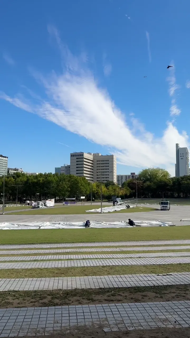 Open lawn and blue sky at Pyeongchon Central Park near Beomgye Station