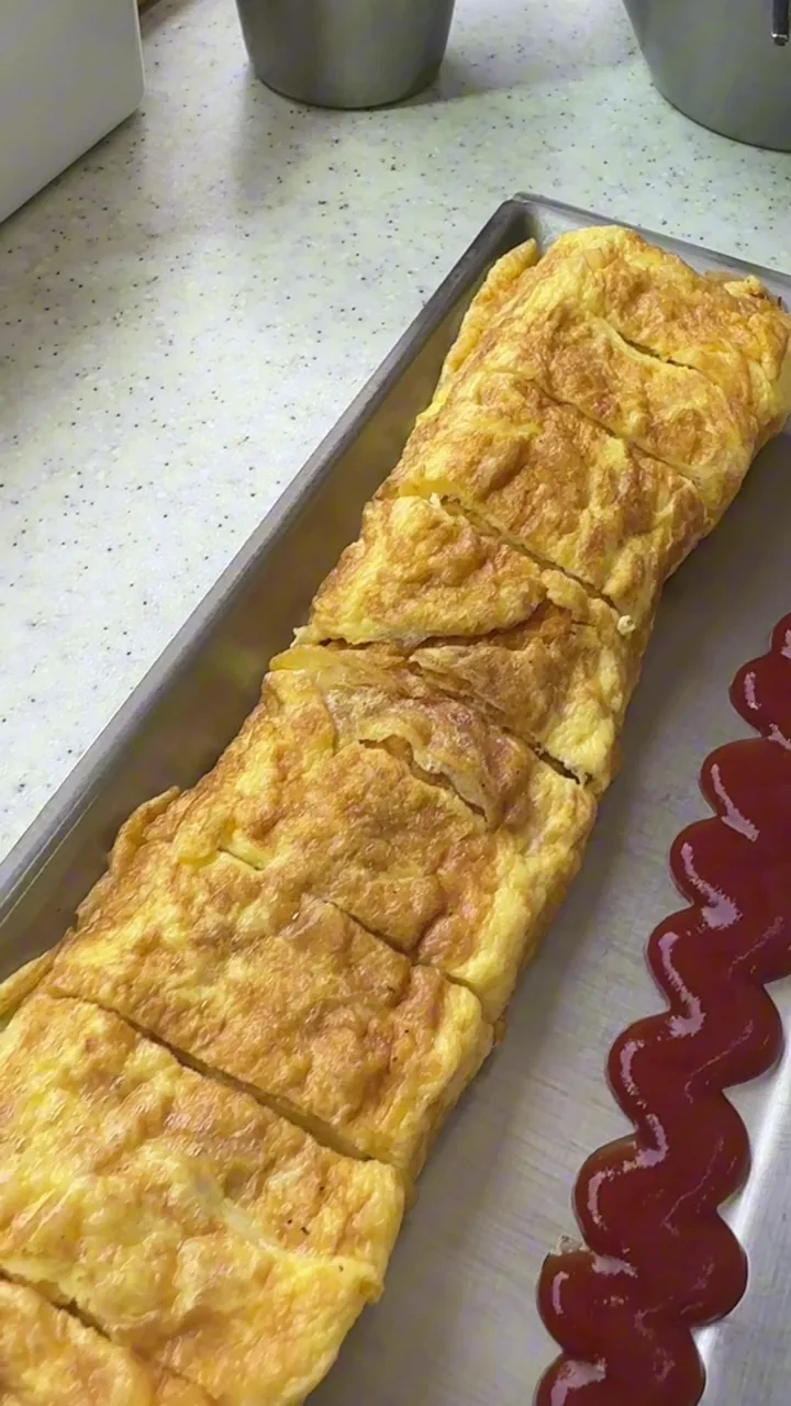 Long rolled omelet served with our two-person lunch at Dabal Kimchi Jjigae
